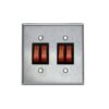 Dual orange toggle switches on a brushed stainless steel wall plate, designed for electrical control.