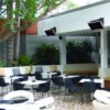 Outdoor lounge area featuring modern seating and greenery, ideal for social gatherings and relaxation.
