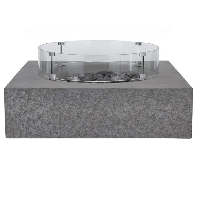 Modern concrete fire pit with glass barrier and decorative stones, ideal for outdoor gatherings and ambiance.