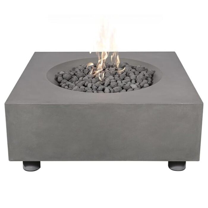 Modern square concrete fire pit with lava rocks and flame, perfect for outdoor gatherings and ambiance.