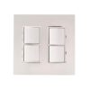 Modern light switch panel with four buttons in a sleek white design.