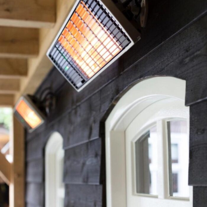 Infrared heaters mounted on a wooden wall, providing warmth in outdoor spaces.