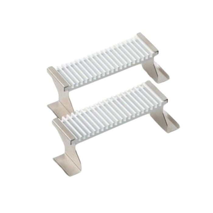 Stainless steel and white plastic food stands for displaying or serving dishes, featuring a ribbed surface for stability.