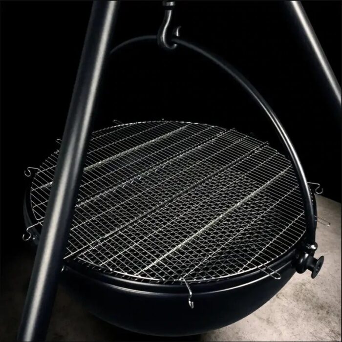 Heavy-duty outdoor grill with a round cooking grate and sturdy hanging design, set against a dark background.