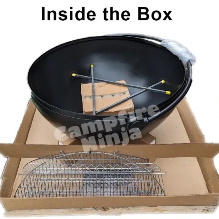Assembly components of a camping fire bowl, including a large black bowl and a chrome grilling rack, displayed inside a cardboard box.