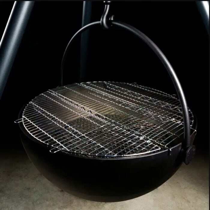 Hanging charcoal grill with a round black base and wire mesh cooking surface, ideal for outdoor barbecuing.